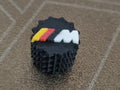 Tire valve cap with BMW logo
